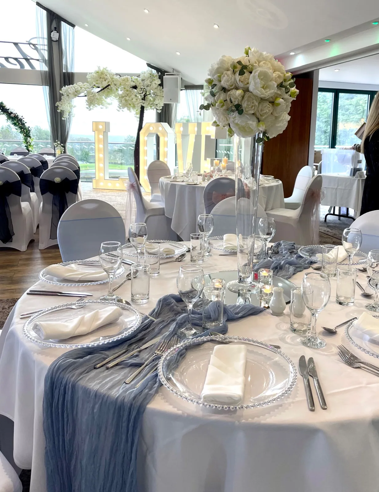 Blue chiffon wedding table styling