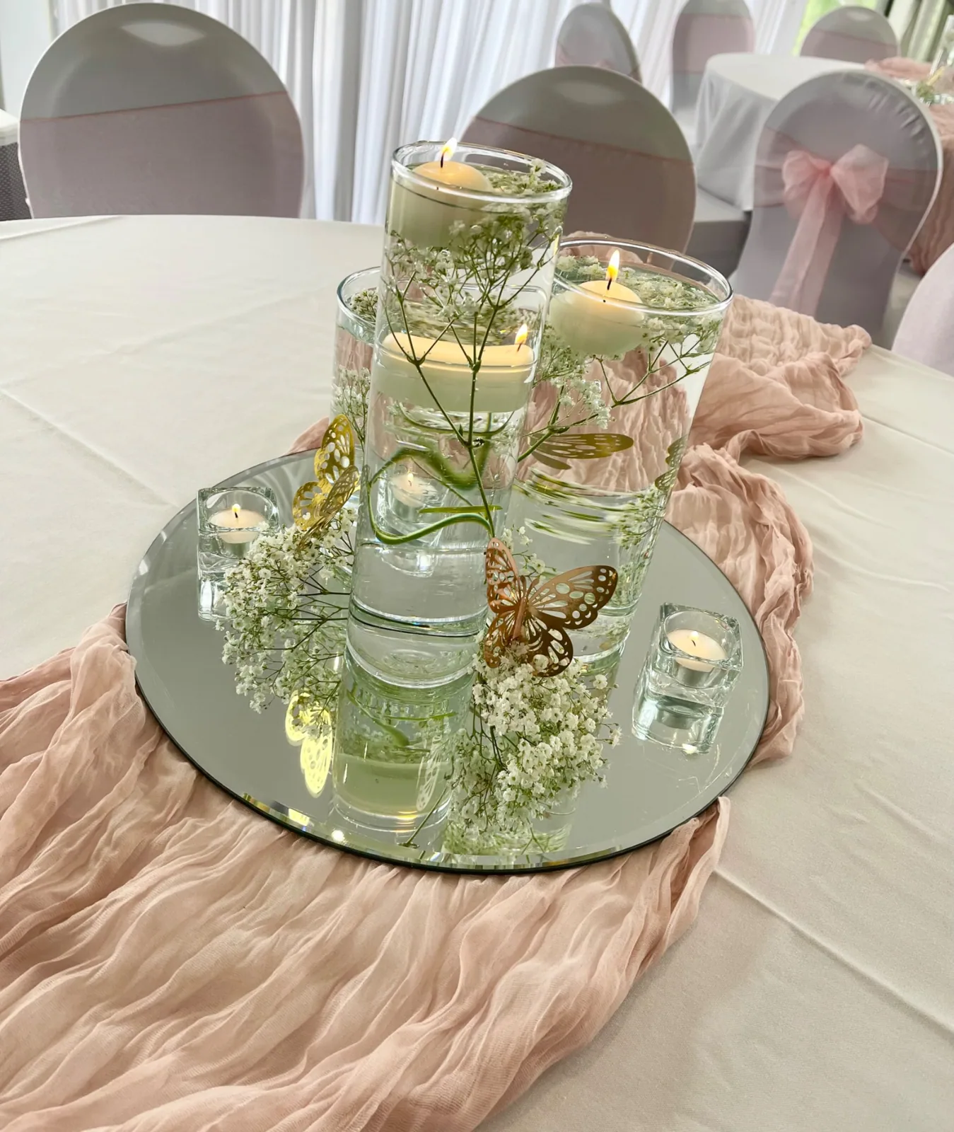 Blush chair bows and candle centrepieces